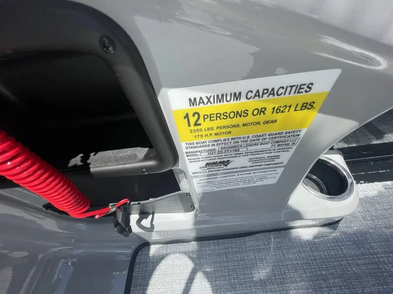 Slide: The Image of 2026 Harris Cruiser 210 capacity label, maximum 12 persons or 1621 lbs, 175 HP motor. - 5