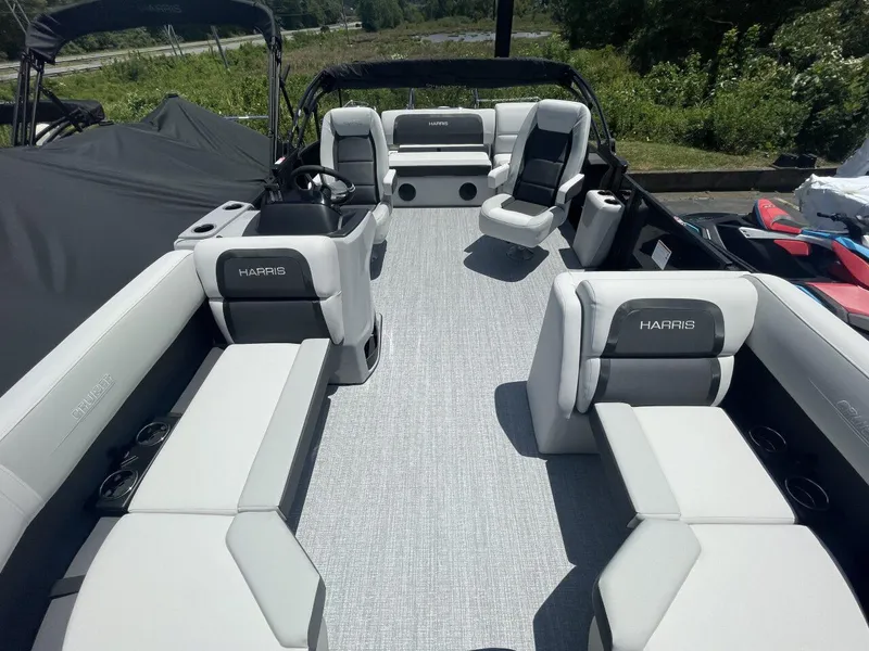 Slide: The Image of 2026 Harris Cruiser 210 pontoon boat interior with gray seating and modern design. - 7