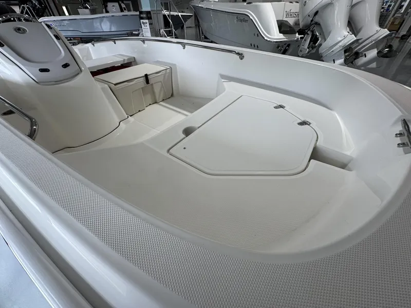 Slide: The Image of 2023 Boston Whaler 160 Super Sport interior, showcasing spacious seating and storage. - 5