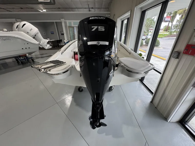Slide: The Image of 2023 Boston Whaler 160 Super Sport with Mercury 75 engine in showroom. - 8