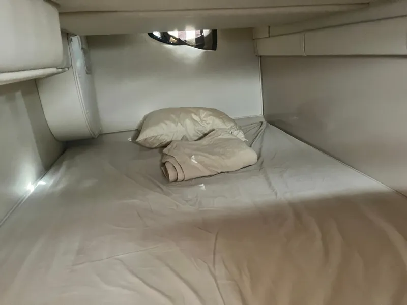 Slide: The Image of Interior cabin of 2003 Doral 330 Elegante CR with bed and pillows. - 4
