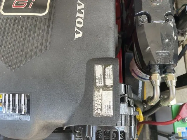 Slide: The Image of Engine compartment of a 2004 Cobalt 226 with Volvo Penta components. - 13