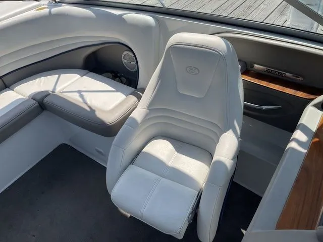 Slide: The Image of Interior of a 2004 Cobalt 226 boat with white seating and wood accents. - 6