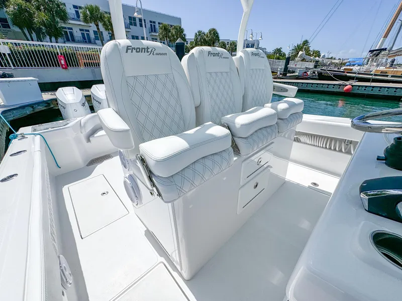 Slide: The Image of Luxury seating on 2025 Front Runner 36 cc boat, docked in marina. - 10