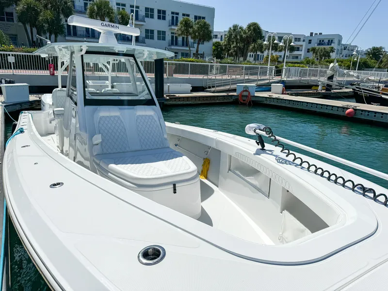 Slide: The Image of 2025 Front Runner 36 cc boat docked in marina, featuring sleek design and modern equipment. - 15