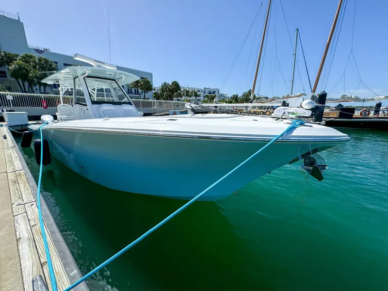 Slide: The Image of 2025 Front Runner 36 cc boat docked in marina, featuring sleek design and modern amenities. - 3