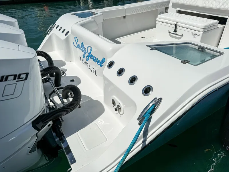 Slide: The Image of 2025 Front Runner 36 cc boat docked, featuring "Salty Jewel" branding, Tampa, FL. - 5