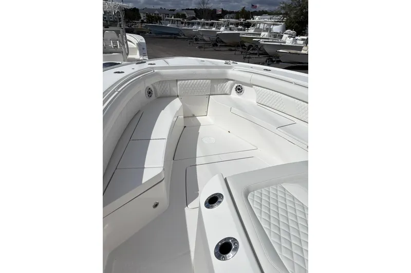 Slide: The Image of 2026 Regulator 35 boat interior with white seating and diamond stitching. - 11