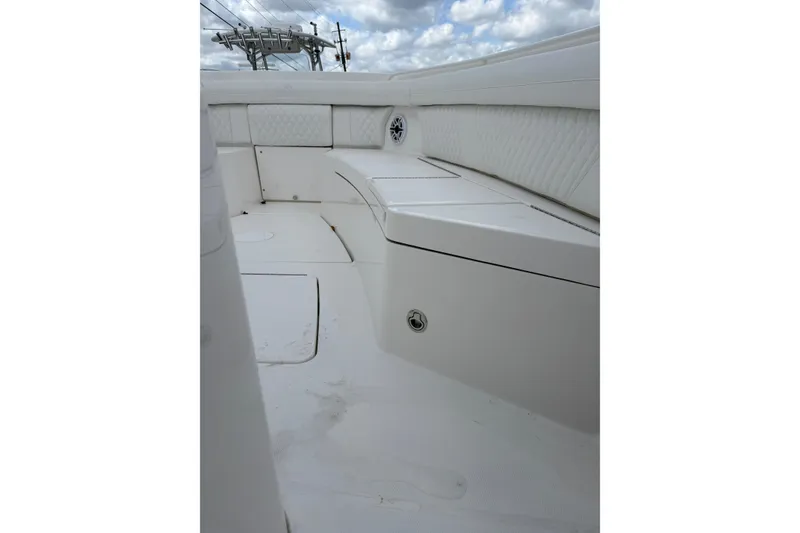 Slide: The Image of 2026 Regulator 35 boat interior with white seating and storage compartments. - 17