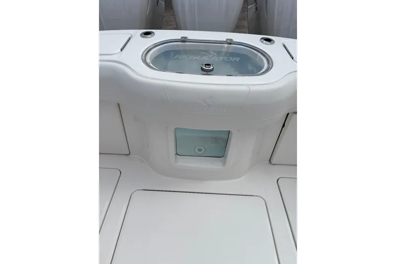 Slide: The Image of 2026 Regulator 35 boat deck with storage compartment and sleek design. - 18