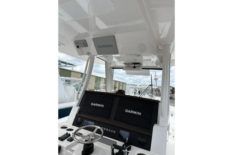Slide: The Image of 2026 Regulator 35 boat dashboard with Garmin navigation system. - 19