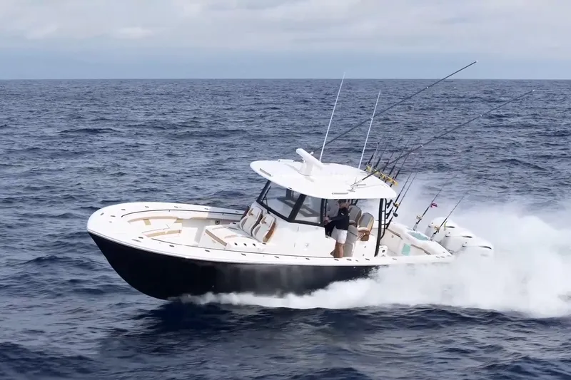 Slide: The Image of 2026 Regulator 35 boat cruising on open ocean with fishing rods. - 3