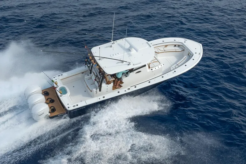 Slide: The Image of 2026 Regulator 35 boat cruising on open ocean with powerful engines. - 5