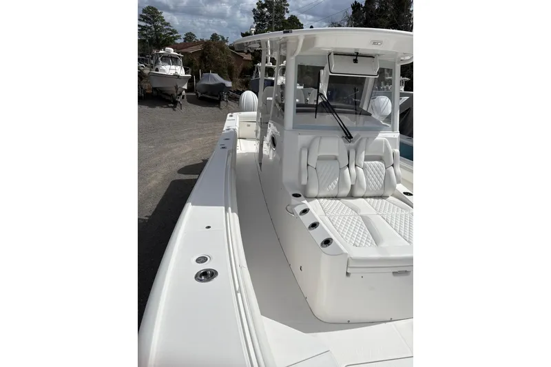 Slide: The Image of 2026 Regulator 35 boat with sleek white design and spacious seating. - 7