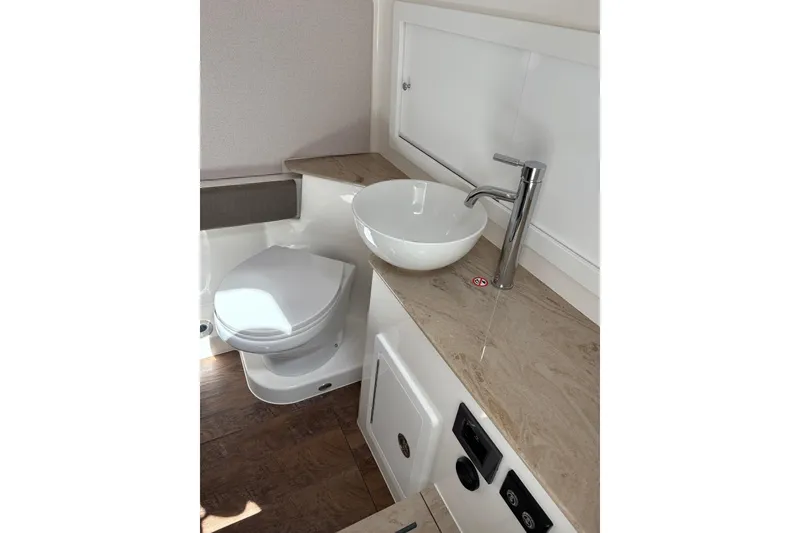 Slide: The Image of Modern bathroom in 2026 Regulator 35 boat with sleek sink and toilet. - 8