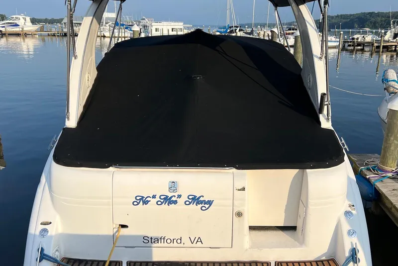 Slide: The Image of 2006 Maxum 3100 SE boat docked, covered with black tarp, Stafford, VA. - 3