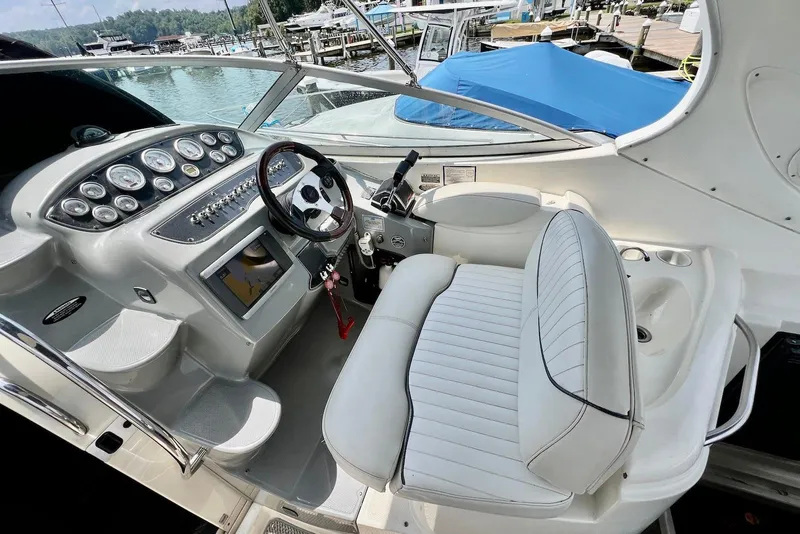 Slide: The Image of 2006 Maxum 3100 SE boat cockpit with steering wheel and control panel. - 5
