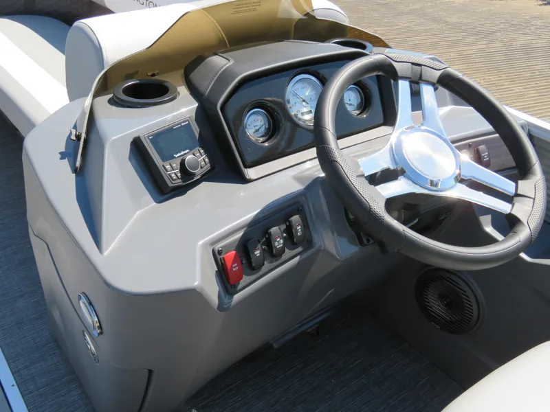Slide: The Image of 2024 Bennington S22 SB boat dashboard with steering wheel and control panel. - 7