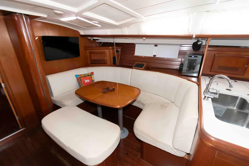 Slide: The Image of Luxurious interior of 2002 Beneteau 473 yacht with cozy seating and modern amenities. - 20