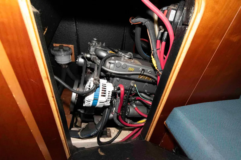 Slide: The Image of Engine compartment of a 2002 Beneteau 473 sailboat, featuring wiring and components. - 30