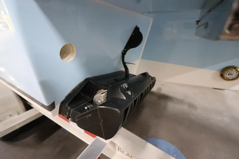 Slide: The Image of 2024 SeaCraft 23CC boat transom with mounted equipment and wiring detail. - 15