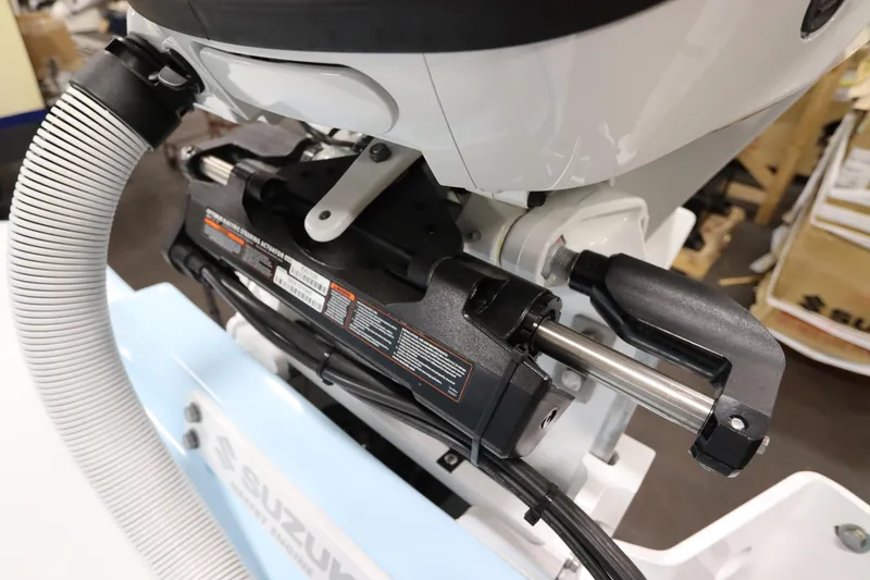 Slide: The Image of 2024 SeaCraft 23CC boat engine detail with Suzuki components and hydraulic system. - 22