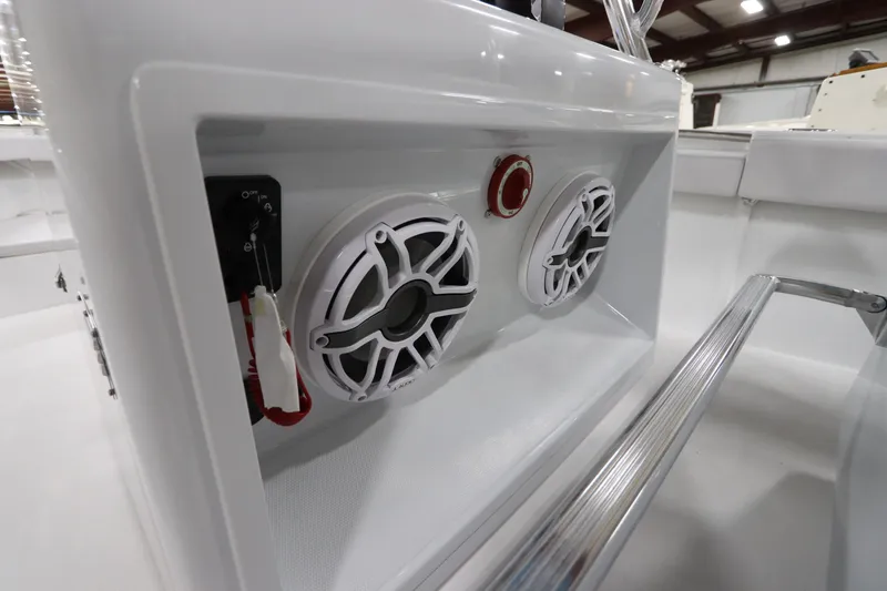 Slide: The Image of 2024 SeaCraft 23CC boat console with speakers and control panel. - 30