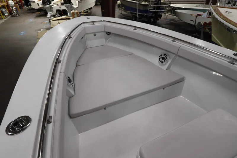 Slide: The Image of 2024 SeaCraft 23CC boat interior with cushioned seating and stainless steel railings. - 39
