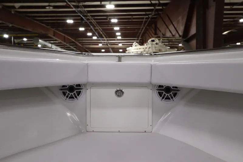 Slide: The Image of 2024 SeaCraft 23CC boat interior with speakers and storage compartment. - 41