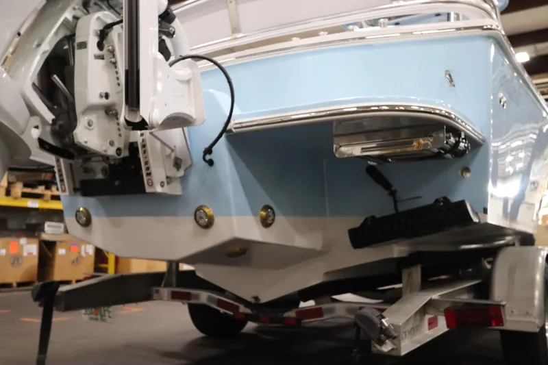 Slide: The Image of 2024 SeaCraft 23CC boat rear view on trailer in warehouse. - 9