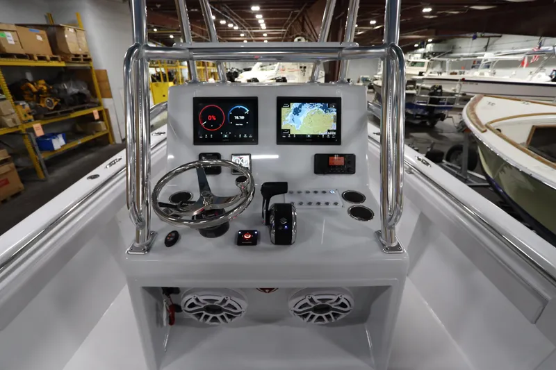 Slide: The Image of 2024 SeaCraft 23CC boat dashboard with modern navigation and control systems. - 29