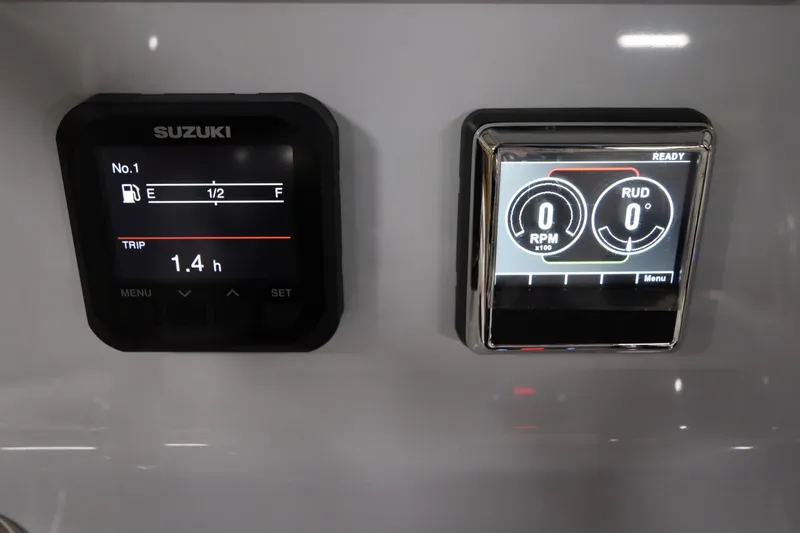 Slide: The Image of 2024 SeaCraft 23CC dashboard with Suzuki fuel gauge and RPM display. - 33