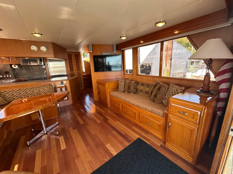 Slide: The Image of Luxurious 1985 Ocean Alexander Pilothouse interior with wood finishes and modern amenities. - 34