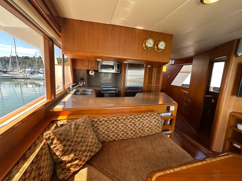 Slide: The Image of Interior of 1985 Ocean Alexander Pilothouse yacht with kitchen and seating area. - 38