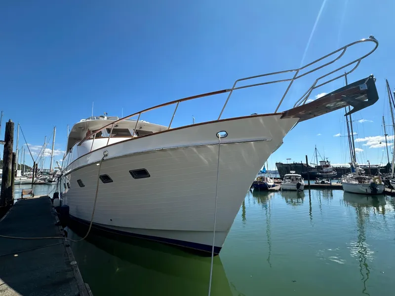 Slide: The Image of 1985 Ocean Alexander Pilothouse yacht docked in a sunny marina. - 4