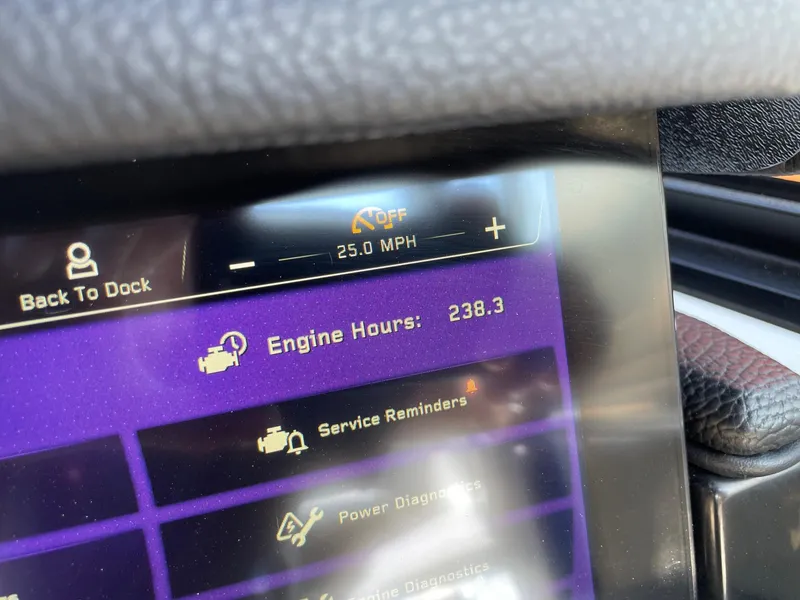 Slide: The Image of Dashboard of 2022 Nautique Super Air G23 showing 238.3 engine hours and 25 MPH speed. - 13