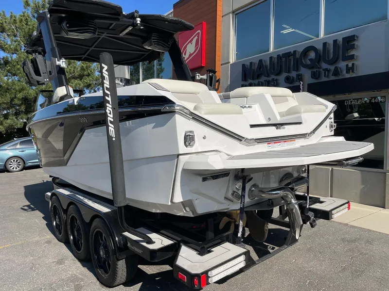 Slide: The Image of 2022 Nautique Super Air G23 boat on trailer at dealership. - 3