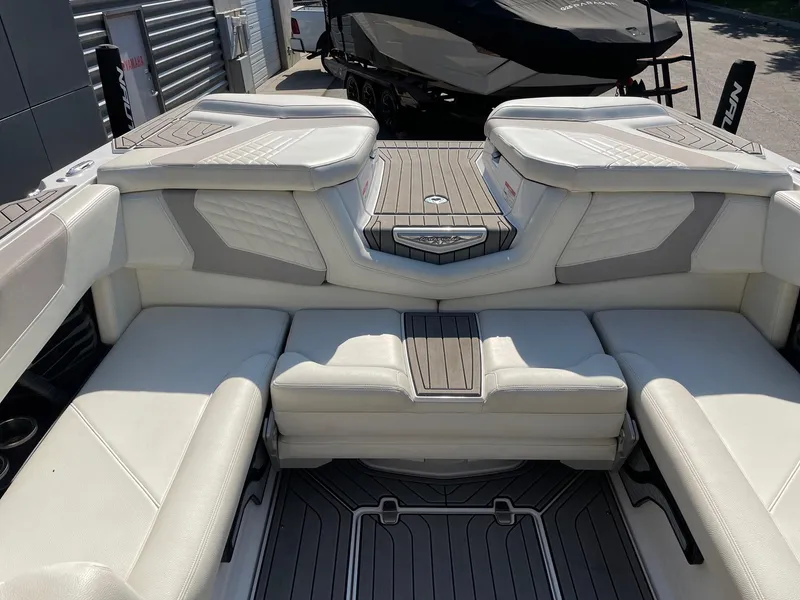 Slide: The Image of 2022 Nautique Super Air G23 boat interior with luxurious seating and modern design. - 8