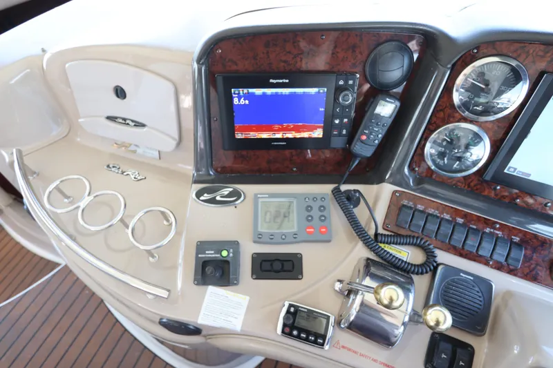 Slide: The Image of Control panel of a 2004 Sea Ray 420 Sundancer boat with navigation equipment. - 23