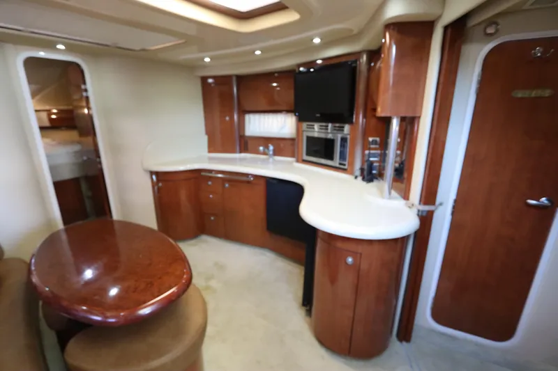Slide: The Image of Luxurious interior of 2004 Sea Ray 420 Sundancer yacht with modern amenities. - 29