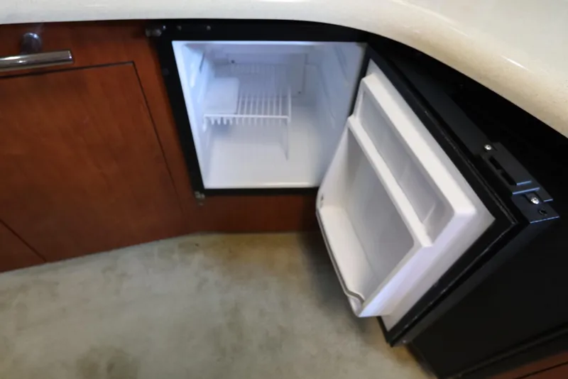 Slide: The Image of Open mini fridge in 2004 Sea Ray 420 Sundancer yacht interior. - 35