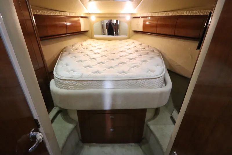 Slide: The Image of Luxurious cabin interior of 2004 Sea Ray 420 Sundancer yacht with plush bed. - 38