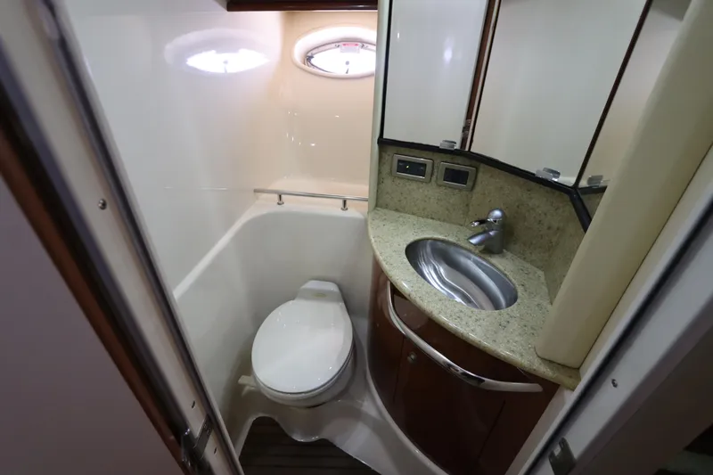 Slide: The Image of Bathroom interior of 2004 Sea Ray 420 Sundancer yacht, featuring sink and toilet. - 41