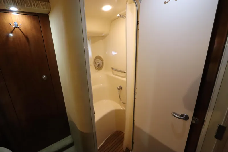 Slide: The Image of Shower area inside 2004 Sea Ray 420 Sundancer yacht, featuring wooden accents and modern fixtures. - 42