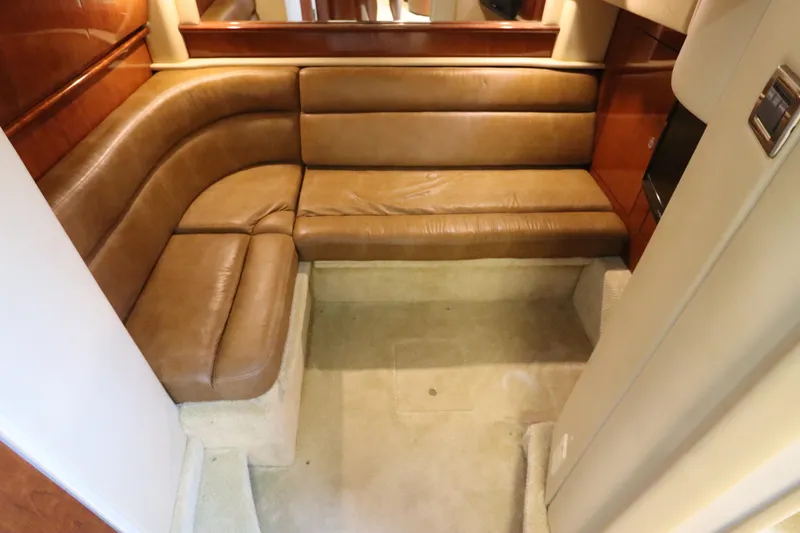 Slide: The Image of Luxurious leather seating area inside a 2004 Sea Ray 420 Sundancer yacht. - 46