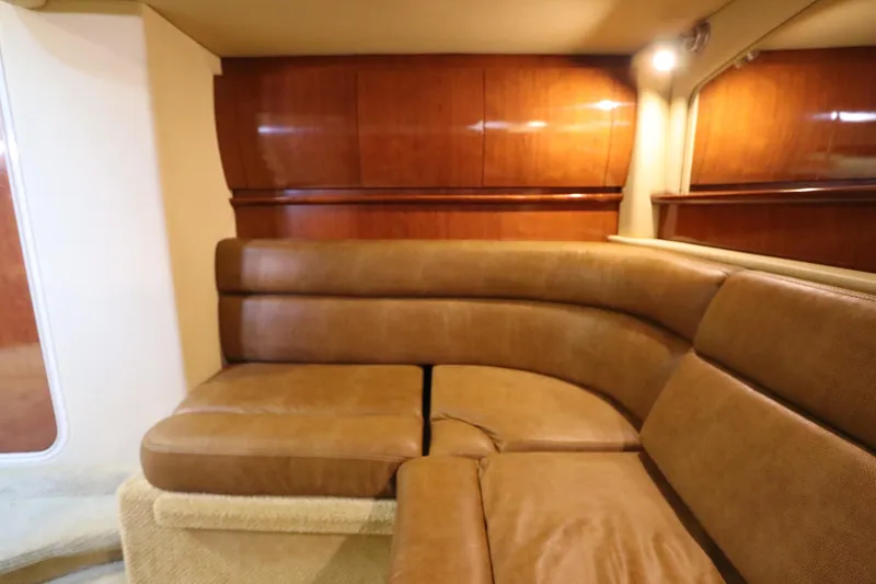 Slide: The Image of Luxurious interior of 2004 Sea Ray 420 Sundancer with plush leather seating. - 47