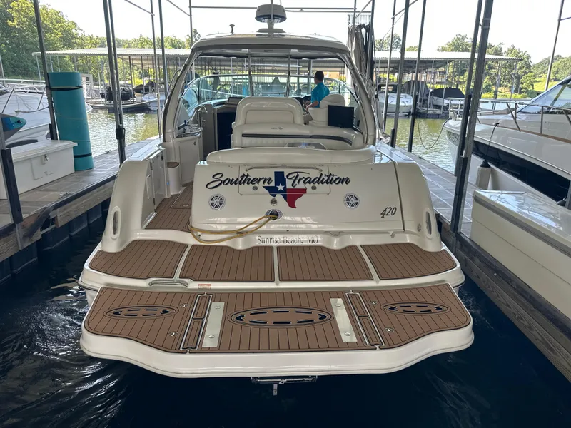 Slide: The Image of 2005 Sea Ray 420 Sundancer docked, featuring "Southern Tradition" branding on the stern. - 13