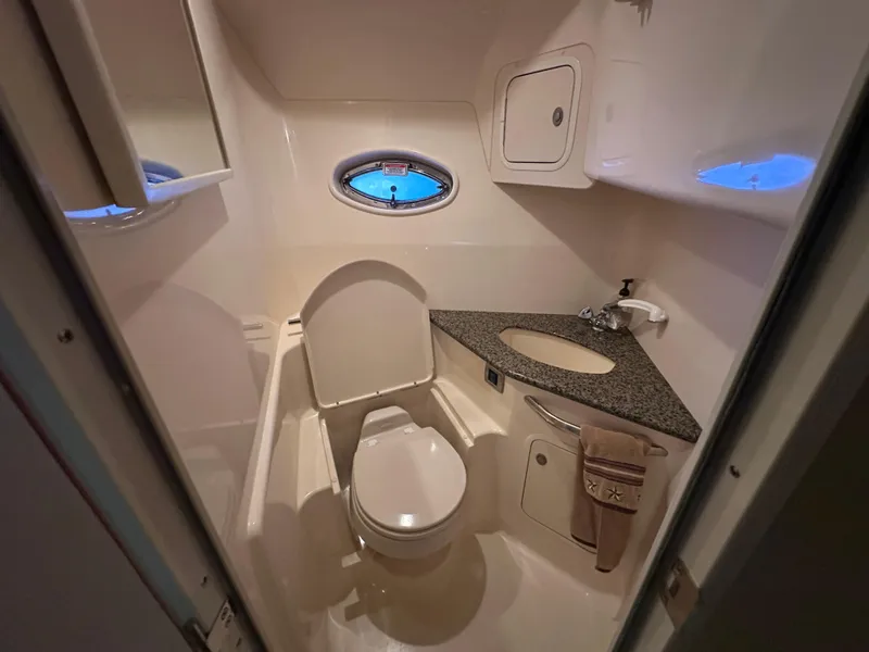 Slide: The Image of Bathroom interior of 2005 Sea Ray 420 Sundancer yacht, featuring toilet and sink. - 32