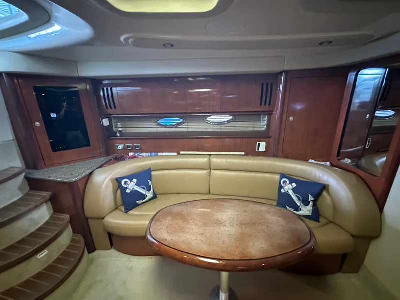 Slide: The Image of Luxurious interior of 2005 Sea Ray 420 Sundancer yacht with leather seating and wooden accents. - 33