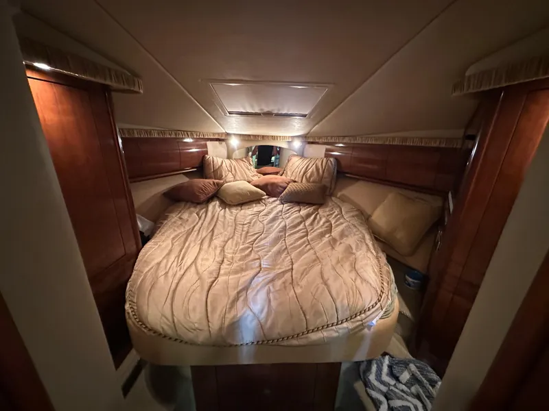 Slide: The Image of Luxurious cabin interior of 2005 Sea Ray 420 Sundancer yacht with cozy bedding. - 34